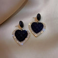 Cercei cu pandantiv în formă de inimă negri din aur
